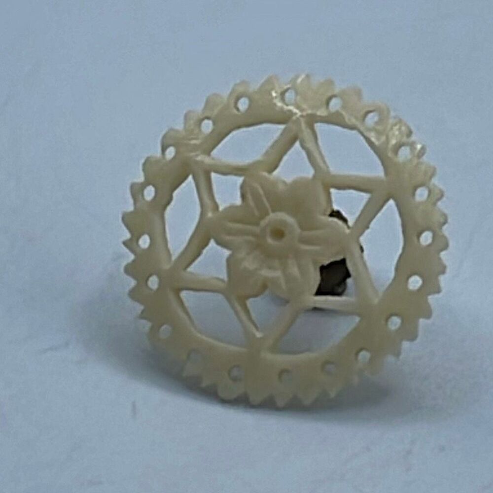 Vintage celluloid flower stick pin cuff or button ?